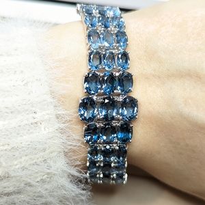 Genuine London blue topaz, white zircon, rhodium plated sterling silver bracelet
